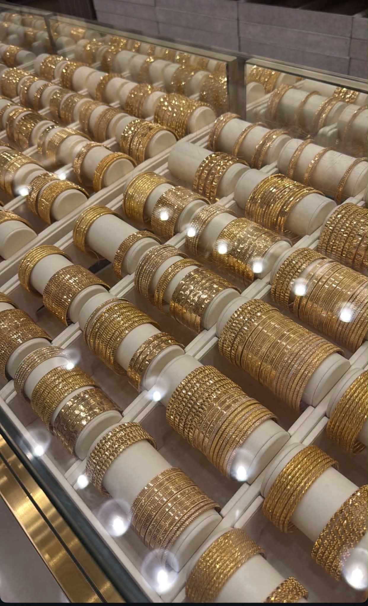 Gold bangle selection in a jewelry display